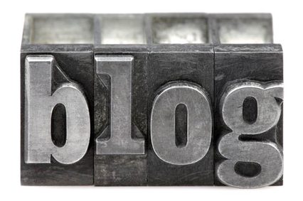 The word Blog in old letterpress printing blocks isolated on a white background