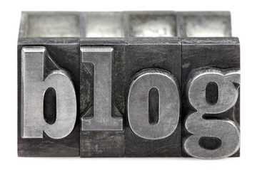 The word Blog in old letterpress printing blocks isolated on a white background
