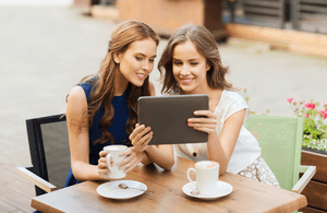 Image of customers watching a video on an iPad