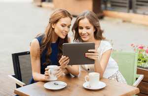 Image of customers watching a video on an iPad