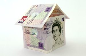 Image of £20 notes making up a paper house