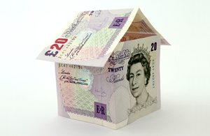 Image of £20 notes making up a paper house