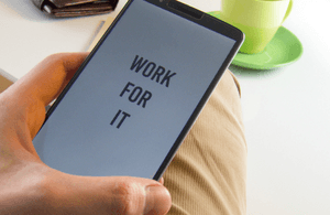 Phone screen showing the words 'Work for it'