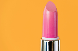 Pink lipstick on an orange background