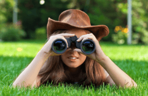 Girl holding binoculars