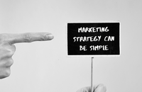 Mini sign saying 'Marketing strategy can be simple'