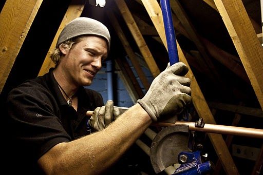 PGS Plumbers in action A plumber from PGS at work