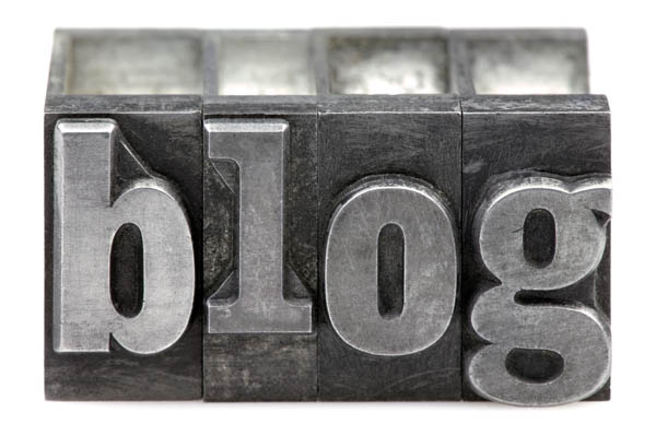 The word Blog in old letterpress printing blocks isolated on a white background